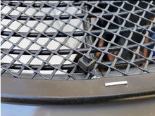leaf guard installed on ac unit close up